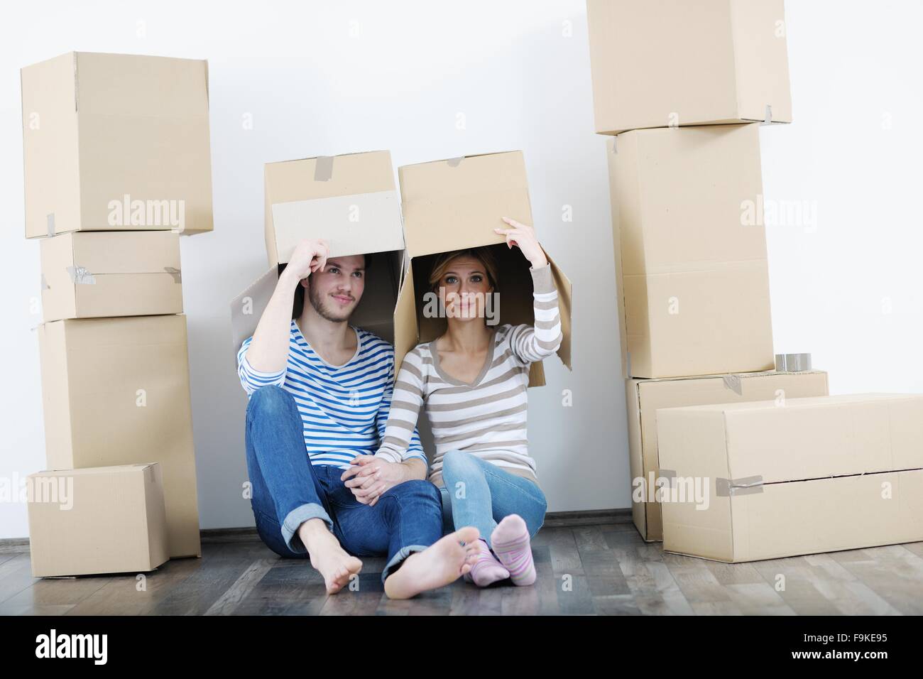 happy Young couple moving in new house Stock Photo - Alamy