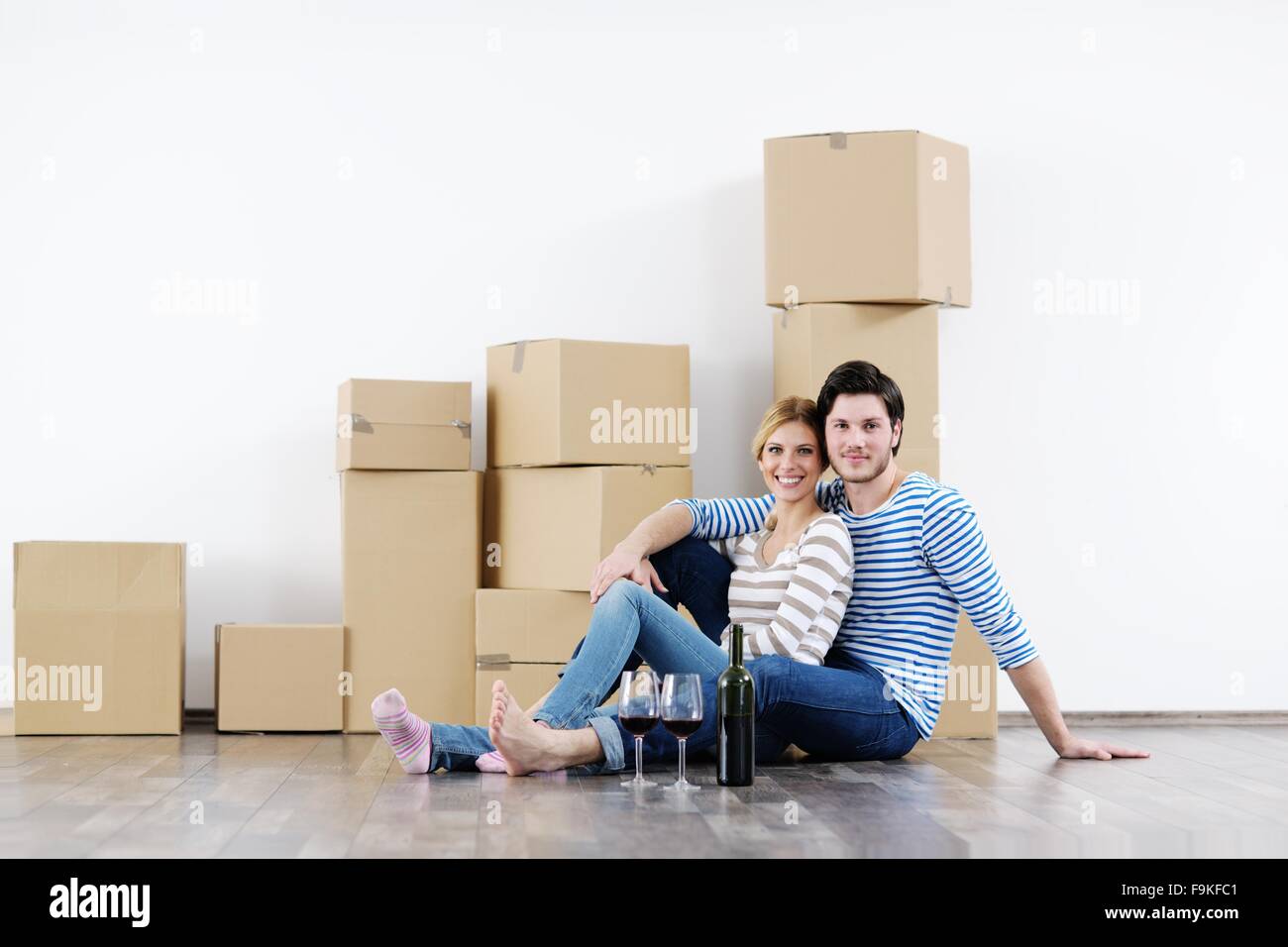 happy Young couple moving in new house Stock Photo - Alamy