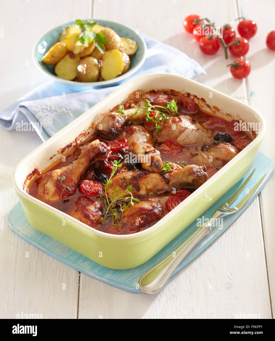 Chicken drumsticks in tomato sauce + steps Stock Photo Alamy