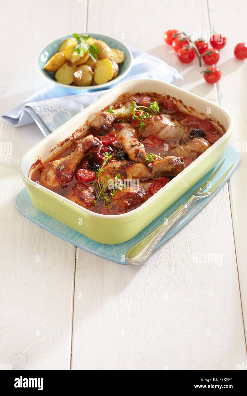 Chicken drumsticks in tomato sauce + steps Stock Photo Alamy