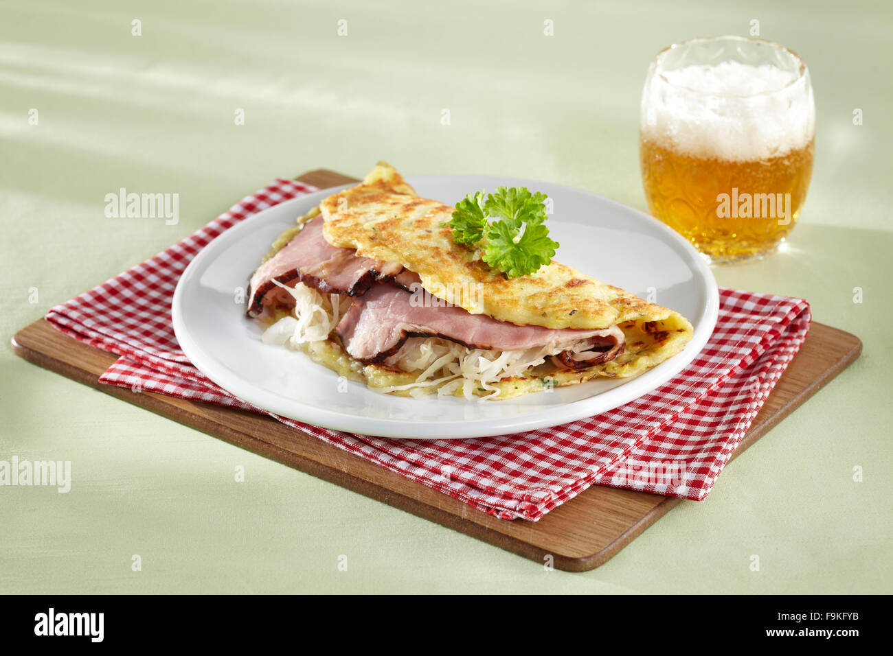 Potato pancake with sauerkraut and pork Stock Photo Alamy