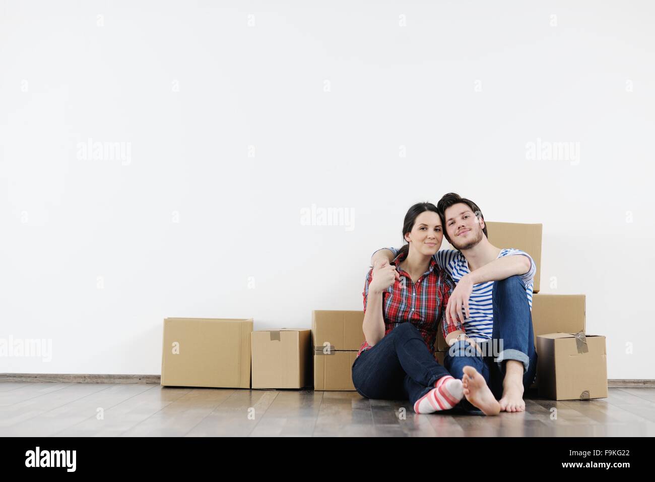 happy Young couple moving in new house Stock Photo - Alamy