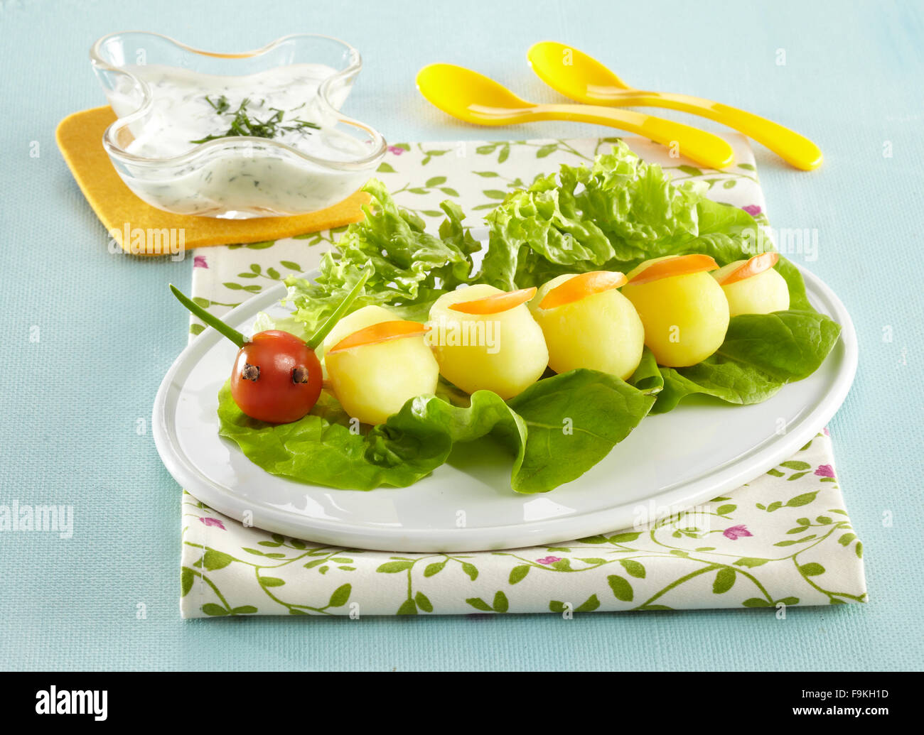Potato caterpillar with herbal dip Stock Photo Alamy
