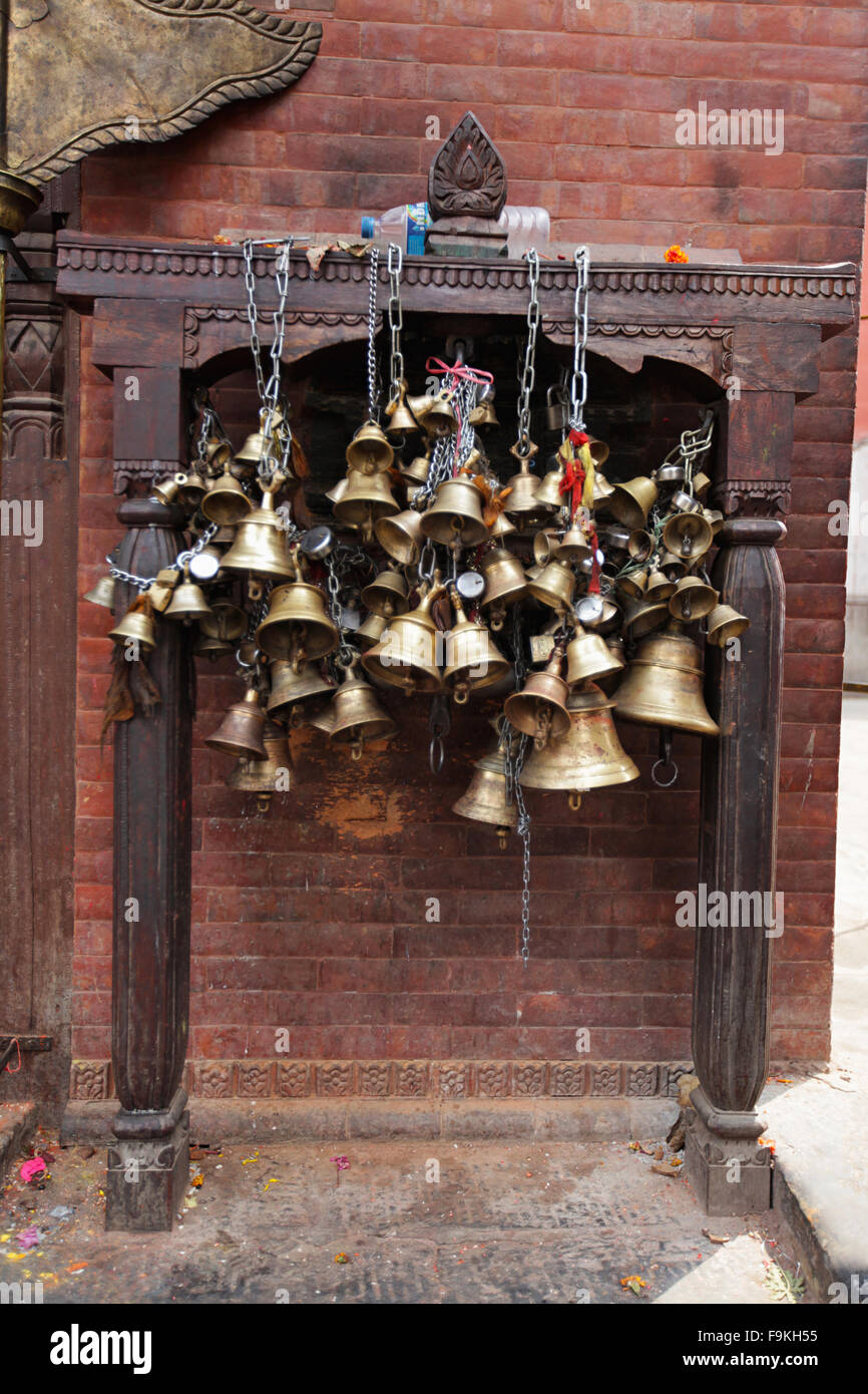 Metal bells offered by devotees. Patan Square Darbar, Nepal. Stock Photo