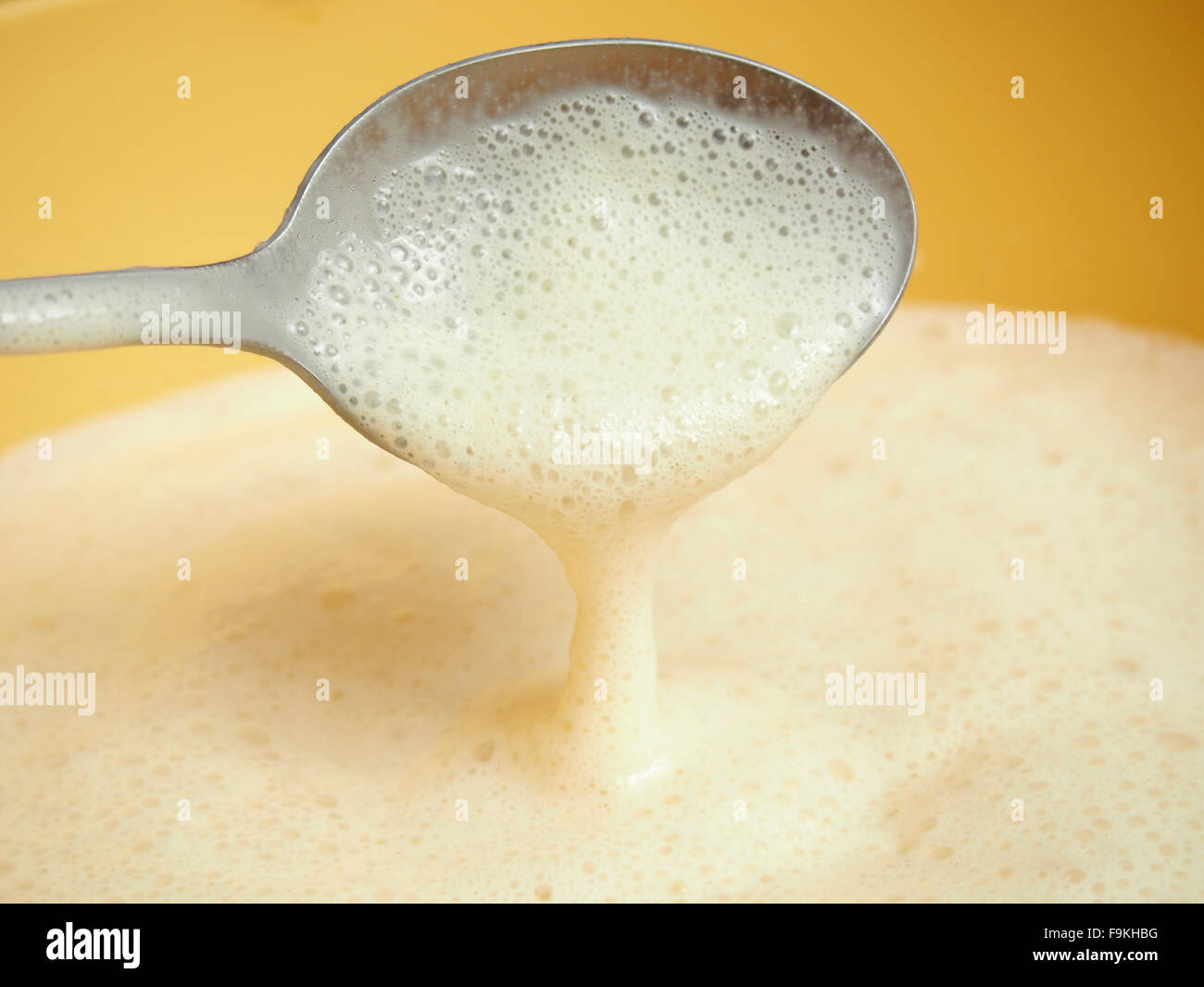 Yeast batter ready to fry. Making yeast pancakes (crepes Stock Photo