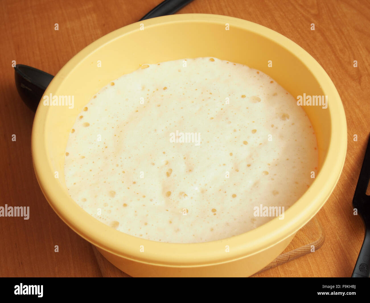 Yeast batter ready to fry. Making yeast pancakes (crepes Stock Photo