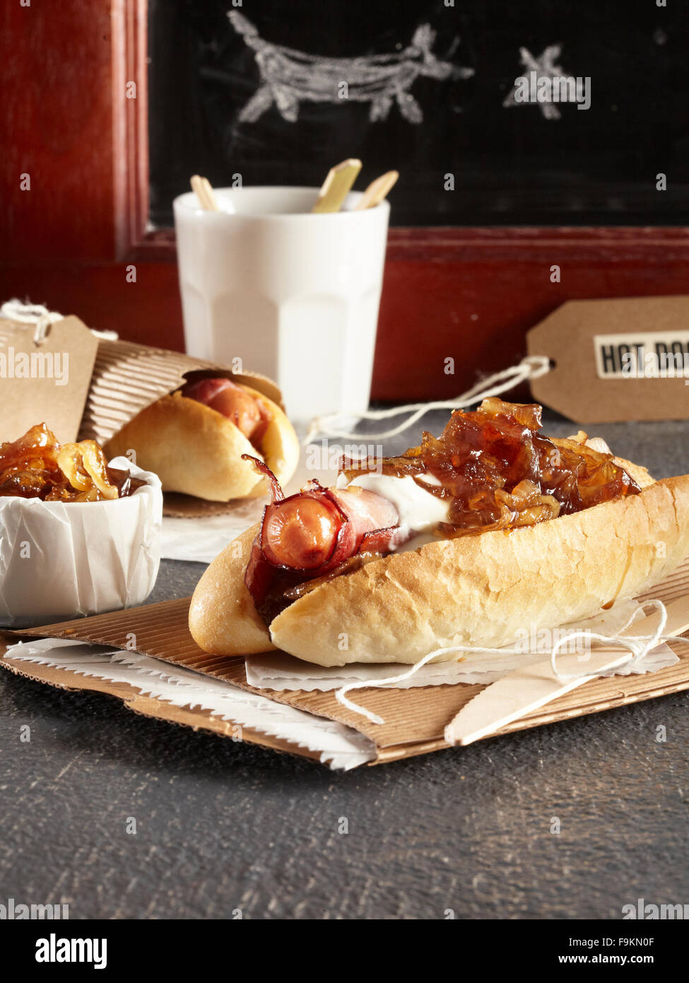 Prosciutto and red onion marmelade hot dog Stock Photo Alamy