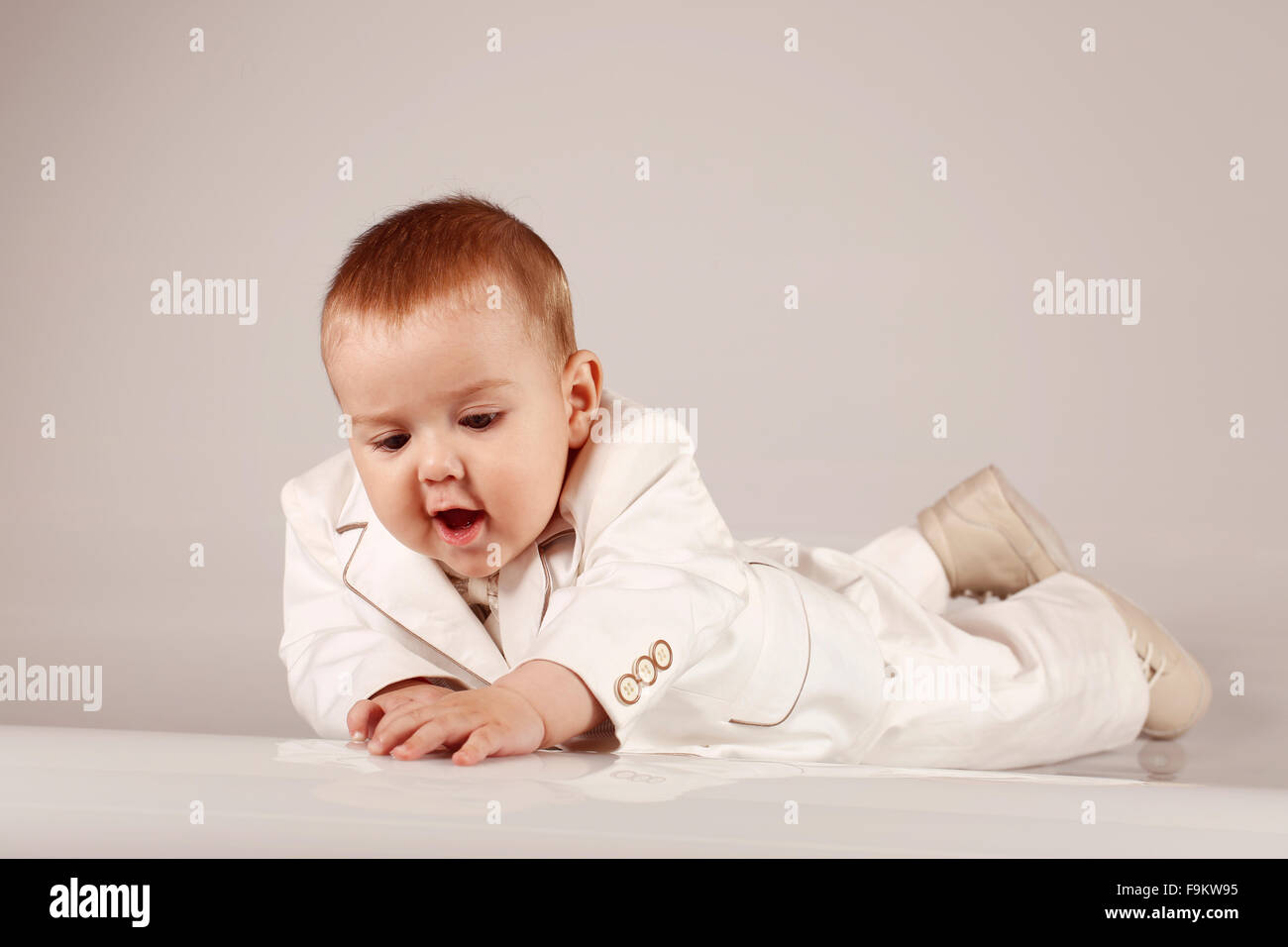 Little baby boy in tuxedo smiling and having fun Stock Photo Alamy