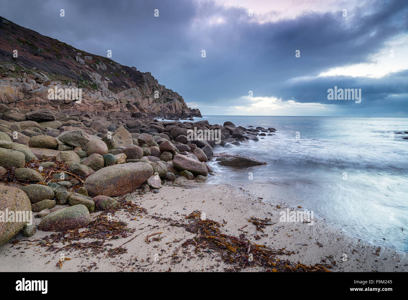 Cloudy dawn at Penberth Cove near Lands End in Cornwall Stock Photo