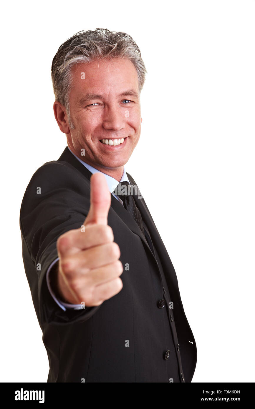 Smiling senior business man holding his thumb up Stock Photo - Alamy