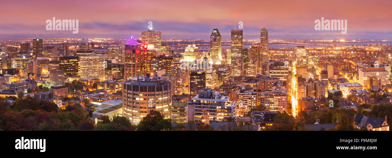The skyline of downtown Montréal, Quebec, Canada from the top of Mount Royal. Photographed at dusk. Stock Photo