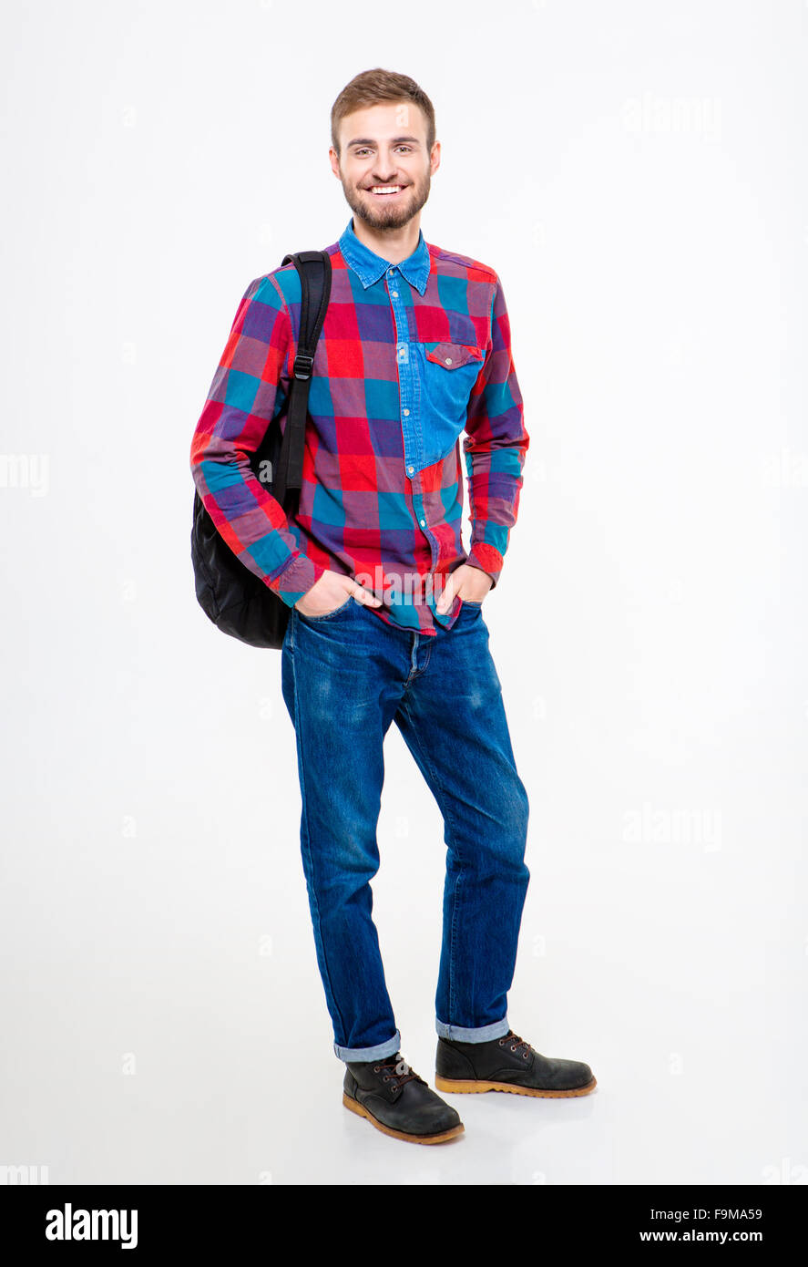 Full length portrait of a happy male student standing with backpack ...