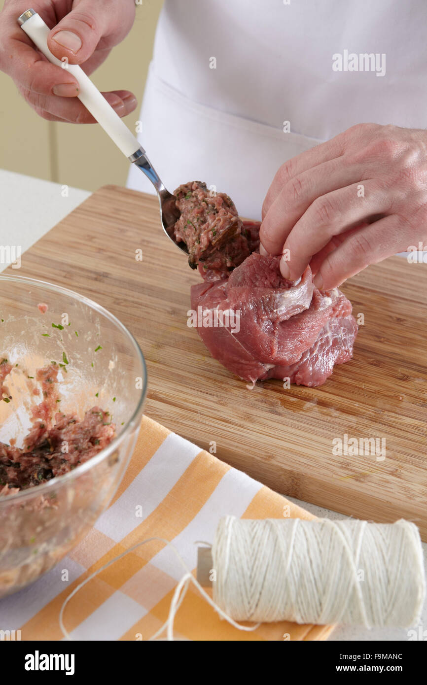 Lamb leg with mushroom stuffing + steps Stock Photo Alamy