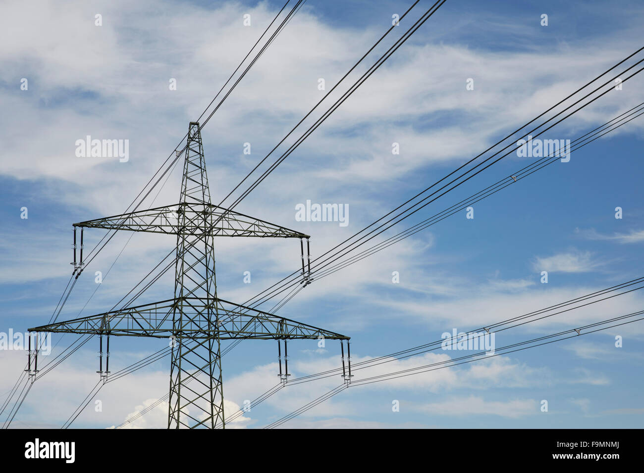 Electricity pylon with wires against a cloudy sky Stock Photo - Alamy