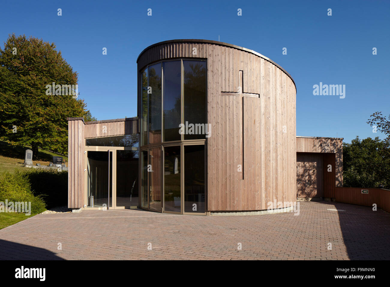 Exterior of a modern cemetery chapel with full height glazed windows at Oberwart, Austria Stock Photo