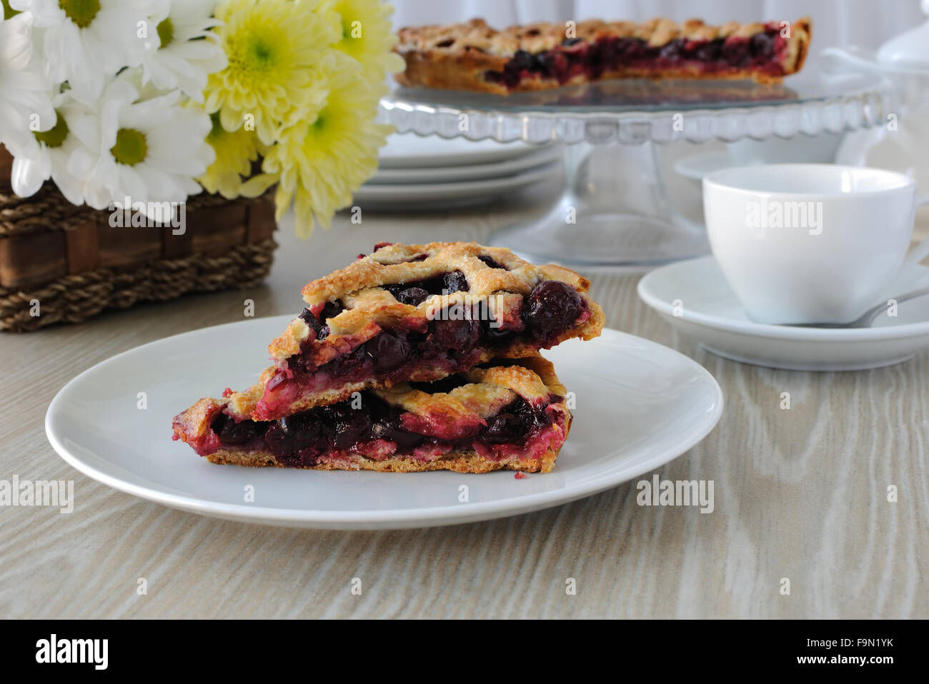 Two slice of cherry pie on a plate on the table Stock Photo