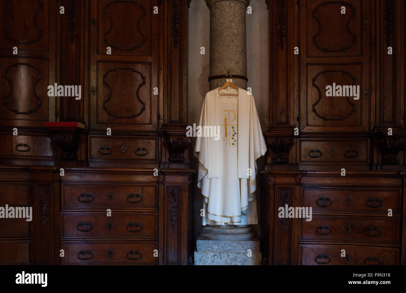 View of cassock, Christian clerical clothing in the church Stock Photo