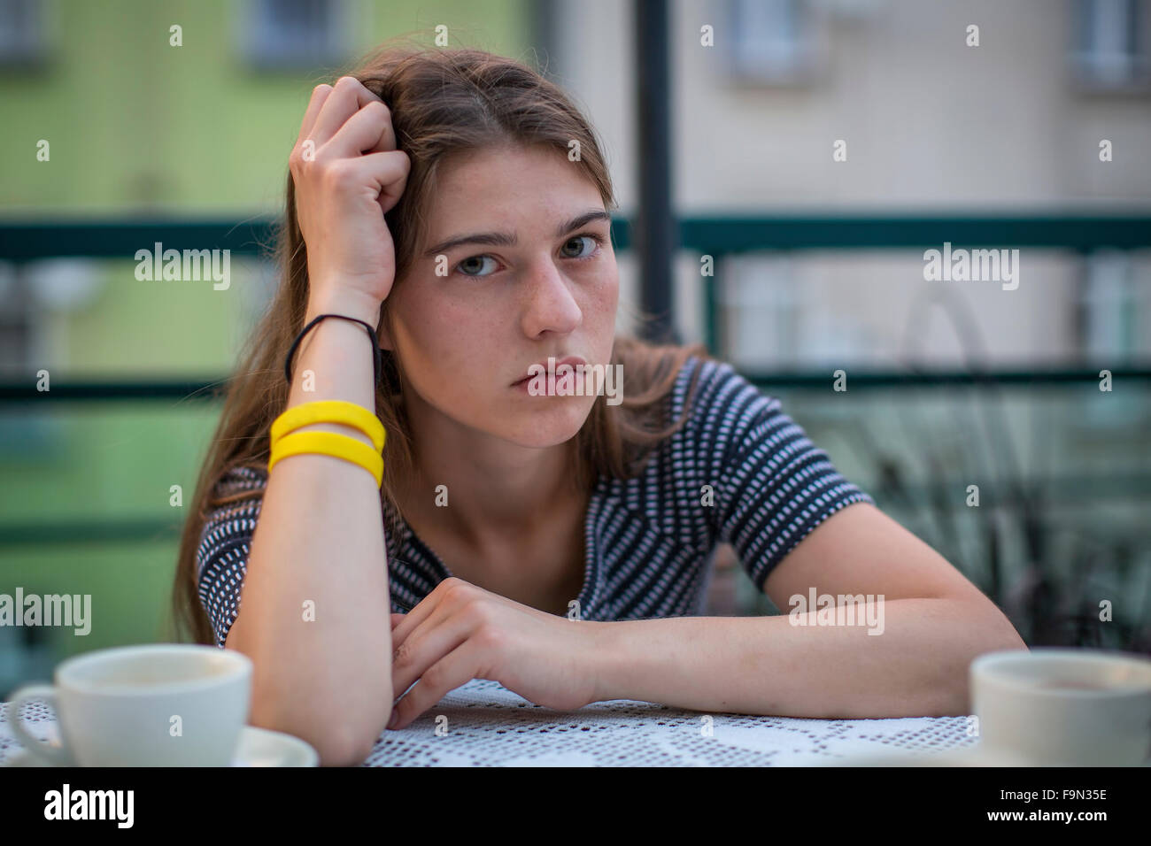 Portrait of young girl with serious look. Stock Photo