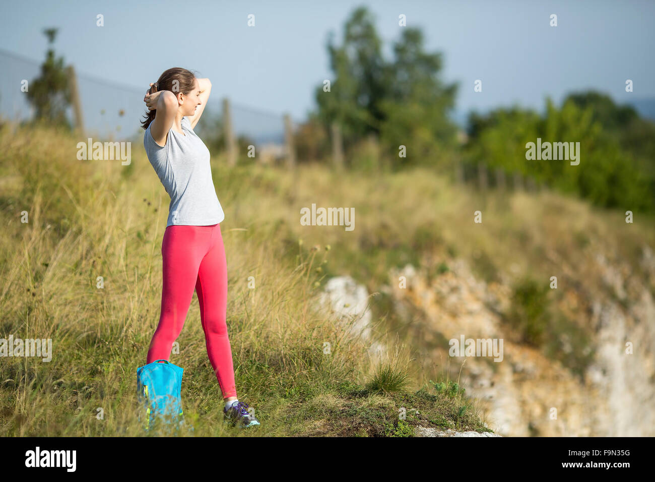 Young sports girl standing outdoors. Stock Photo