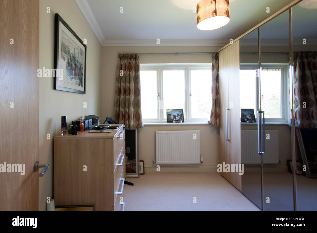 Dressing Room With Wall Of Wardrobes And Mirrors Stock Photo