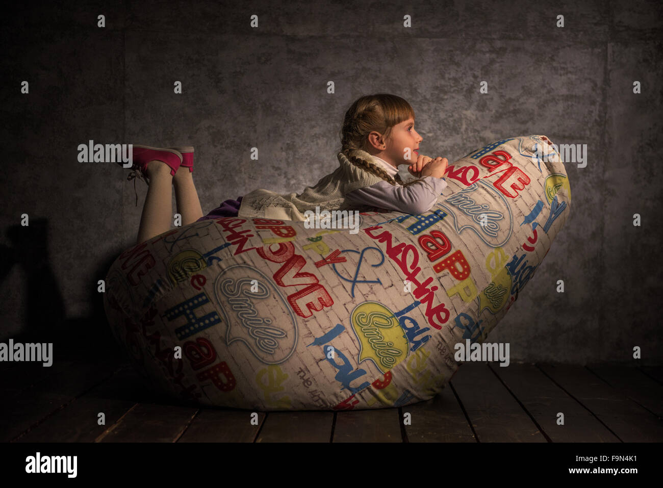 Girl Resting on Beanbag at home Stock Photo - Alamy