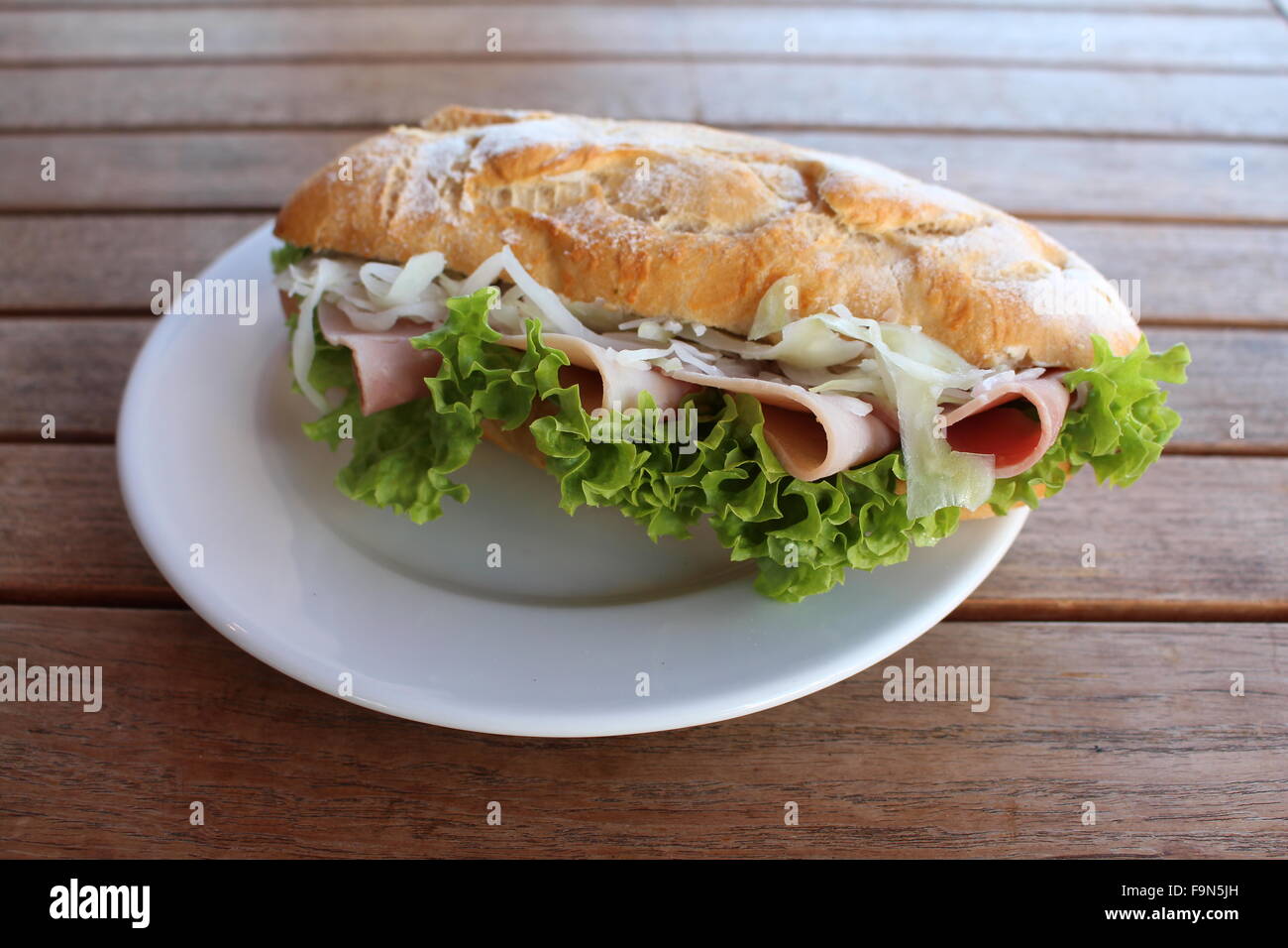 Baguette with ham and salad Stock Photo
