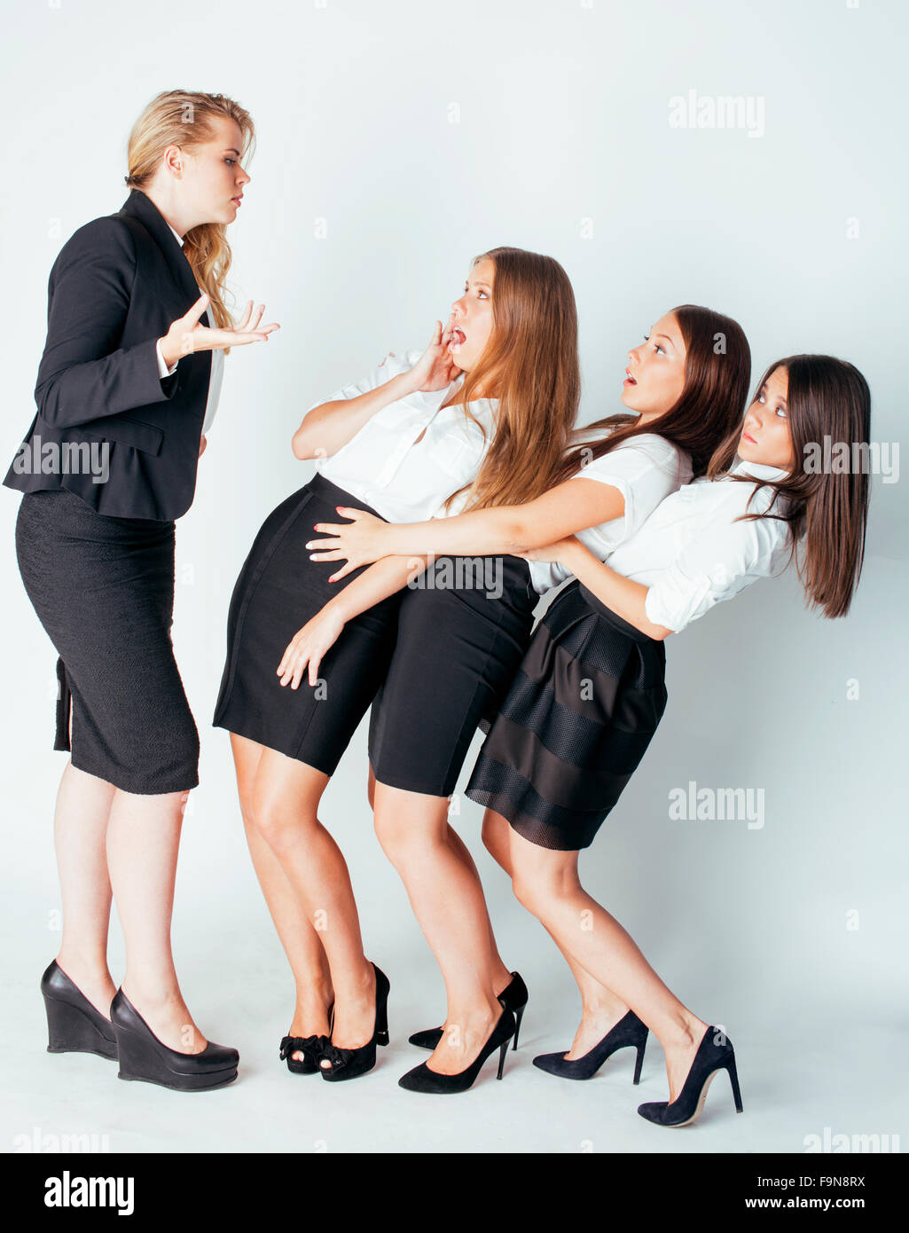 scary lady boss yelling on managers, white background, emotional pressure Stock Photo