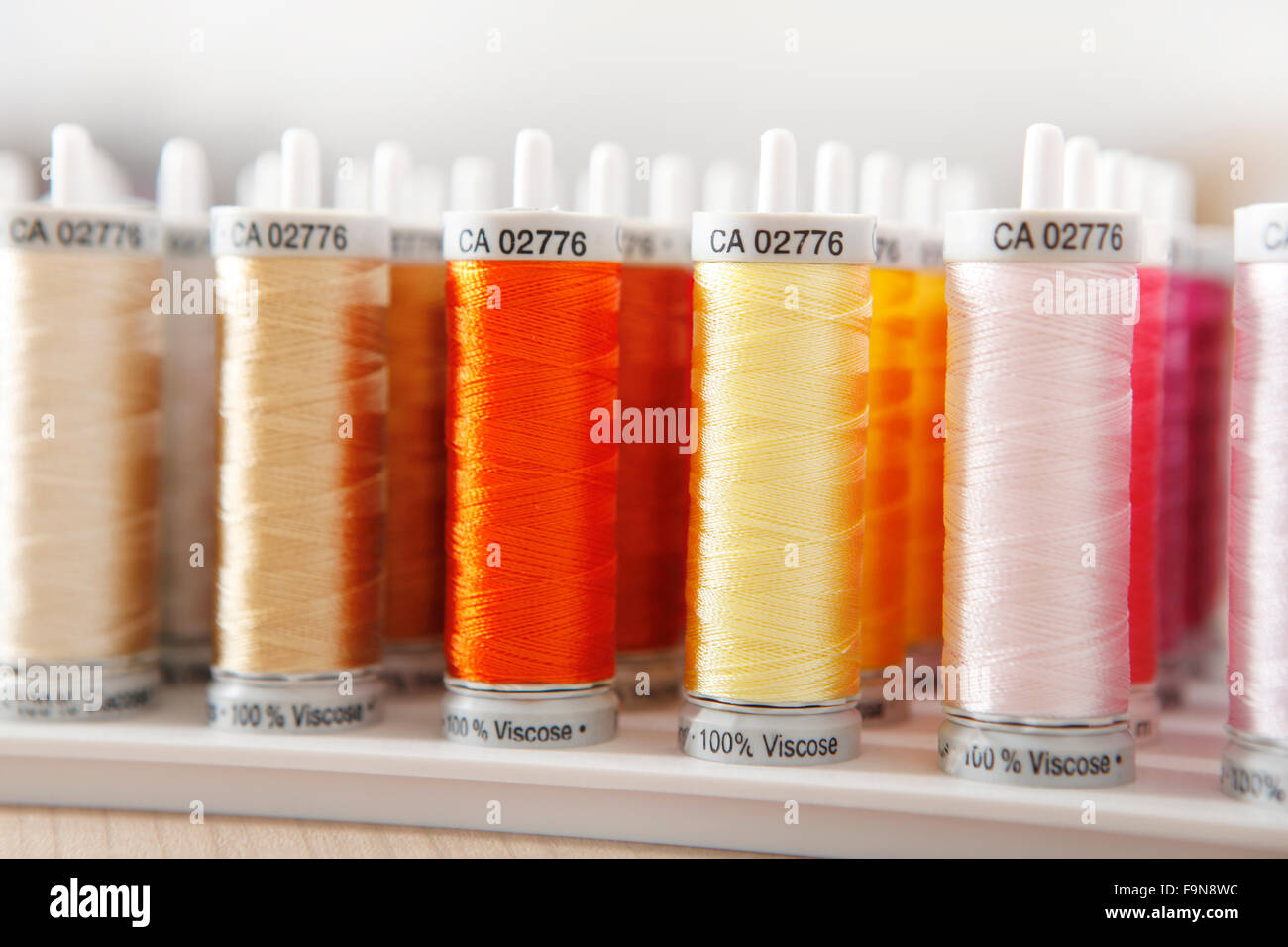 many roles sewing thread in various colors Stock Photo Alamy