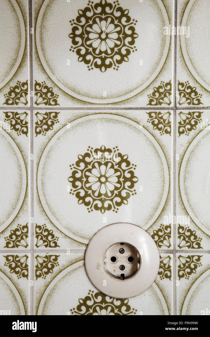 vintage socket in a tiled wall Stock Photo