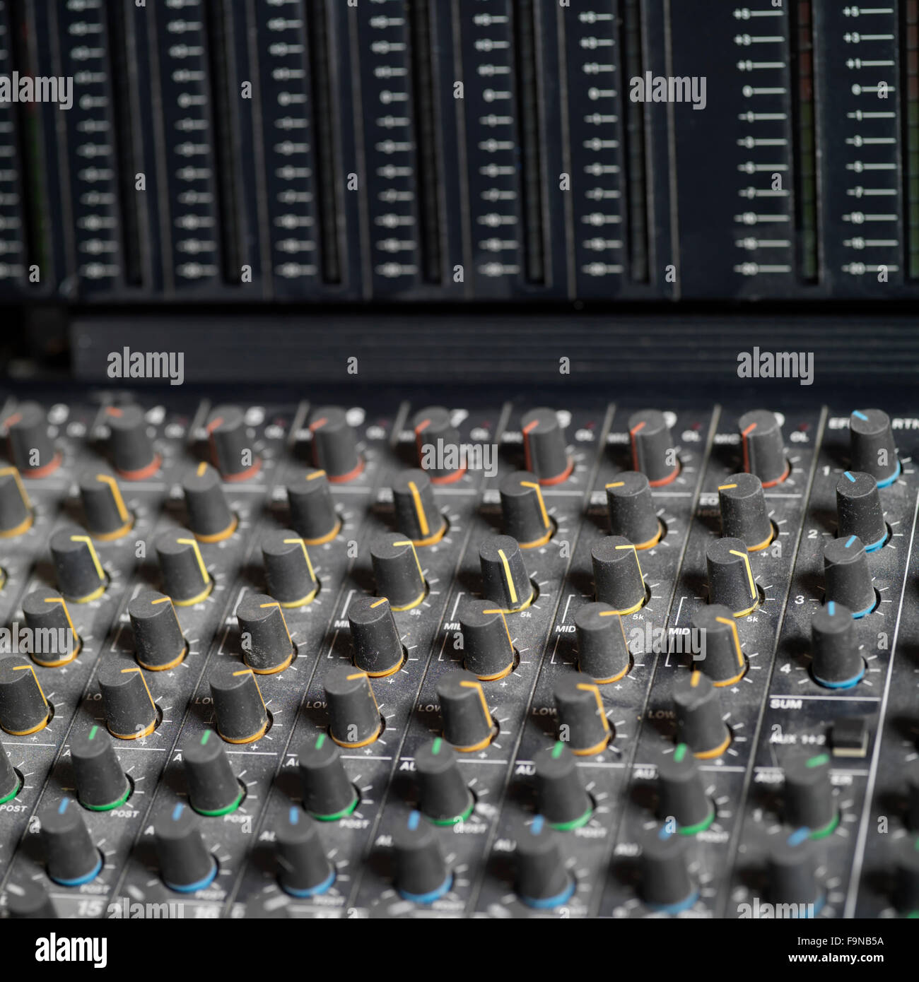 Closeup of mixing console and meter bridge in recording studio Stock