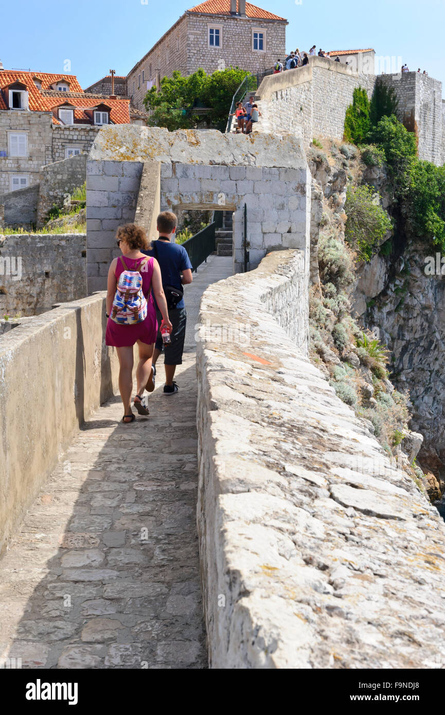 People walking along the perimeter of the old fortress, Dubrovnik, Croatia. Stock Photo