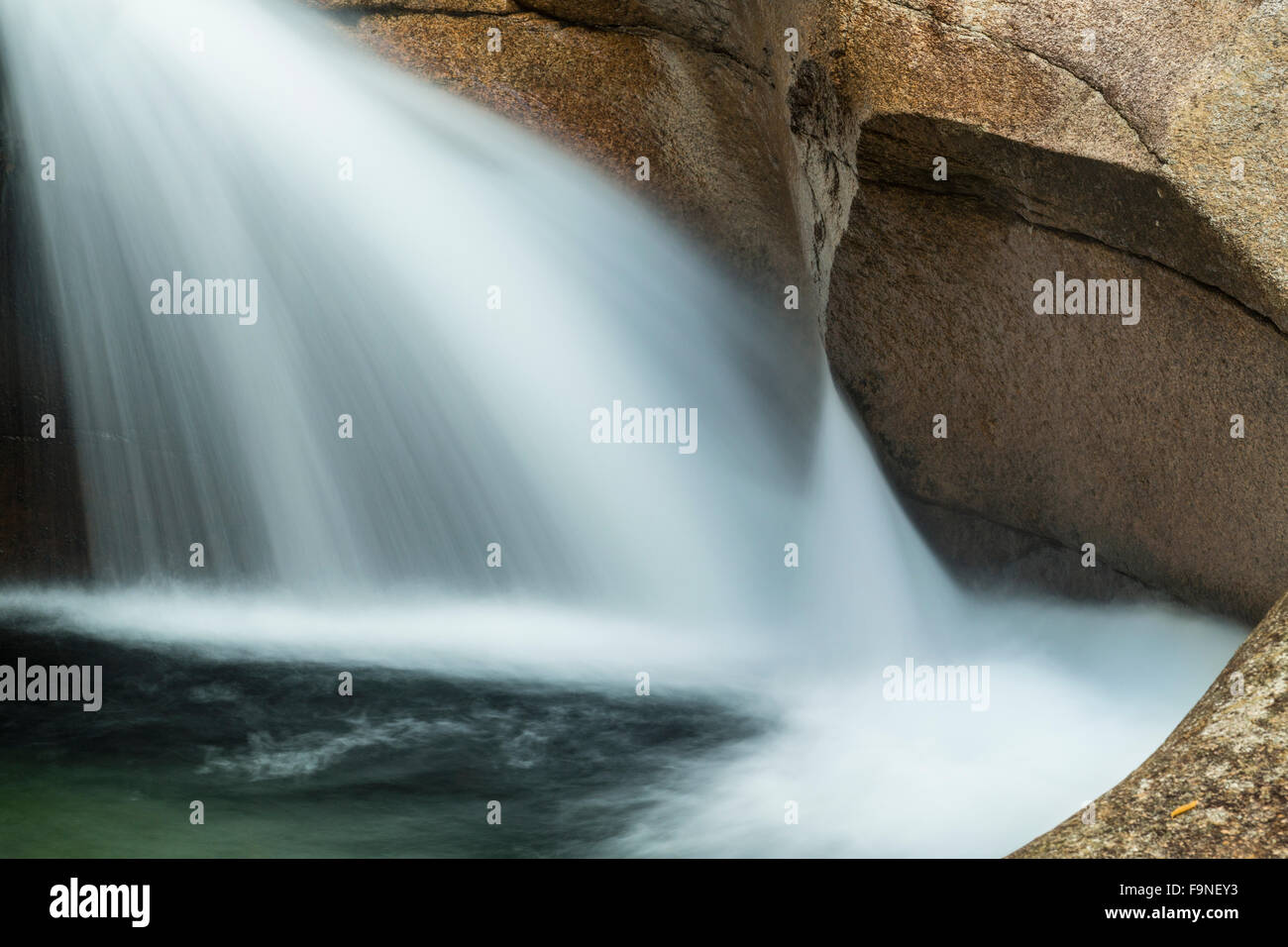 Close view of waterfall known as 'The Basin,' a granite pothole cascade of the Pemigewasset River in Franconia Notch State Park. Stock Photo