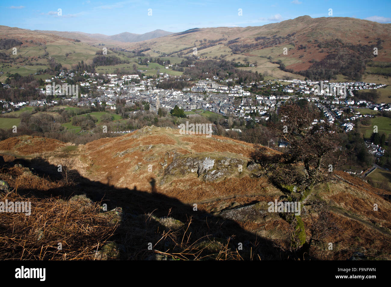 The village of Ambleside lying beneath Wansfell and Wansfell Pike  from Loughrigg Fell Lake District Cumbria England Stock Photo