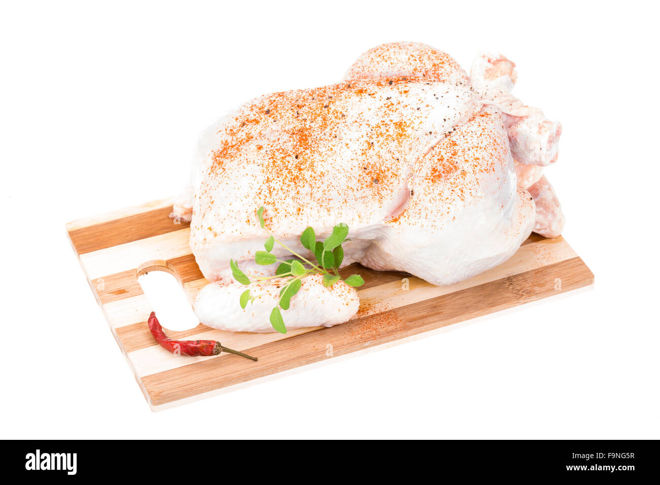 Raw chicken with herbs and spices Stock Photo Alamy