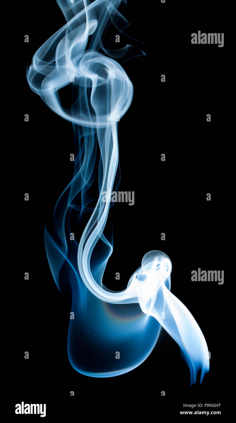 wisp of smoke on black background Stock Photo - Alamy