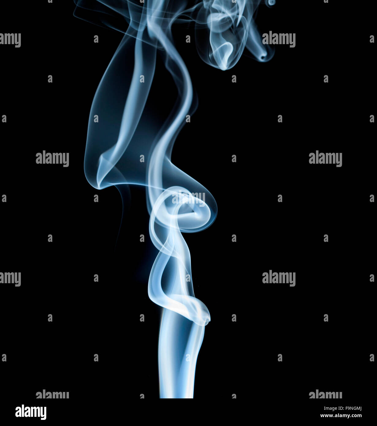 wisp of smoke on black background Stock Photo - Alamy