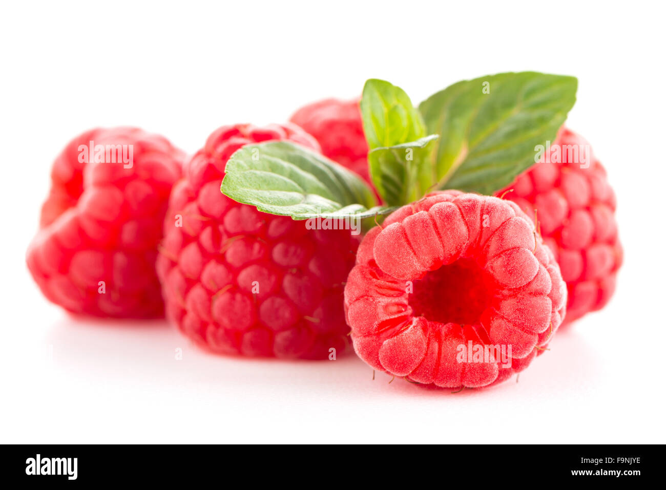 Raspberries with leaves isolated on white background Stock Photo - Alamy