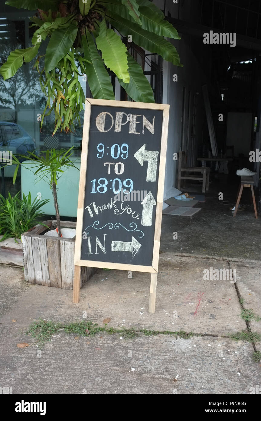 Frame blackboard in front of coffee shop Stock Photo