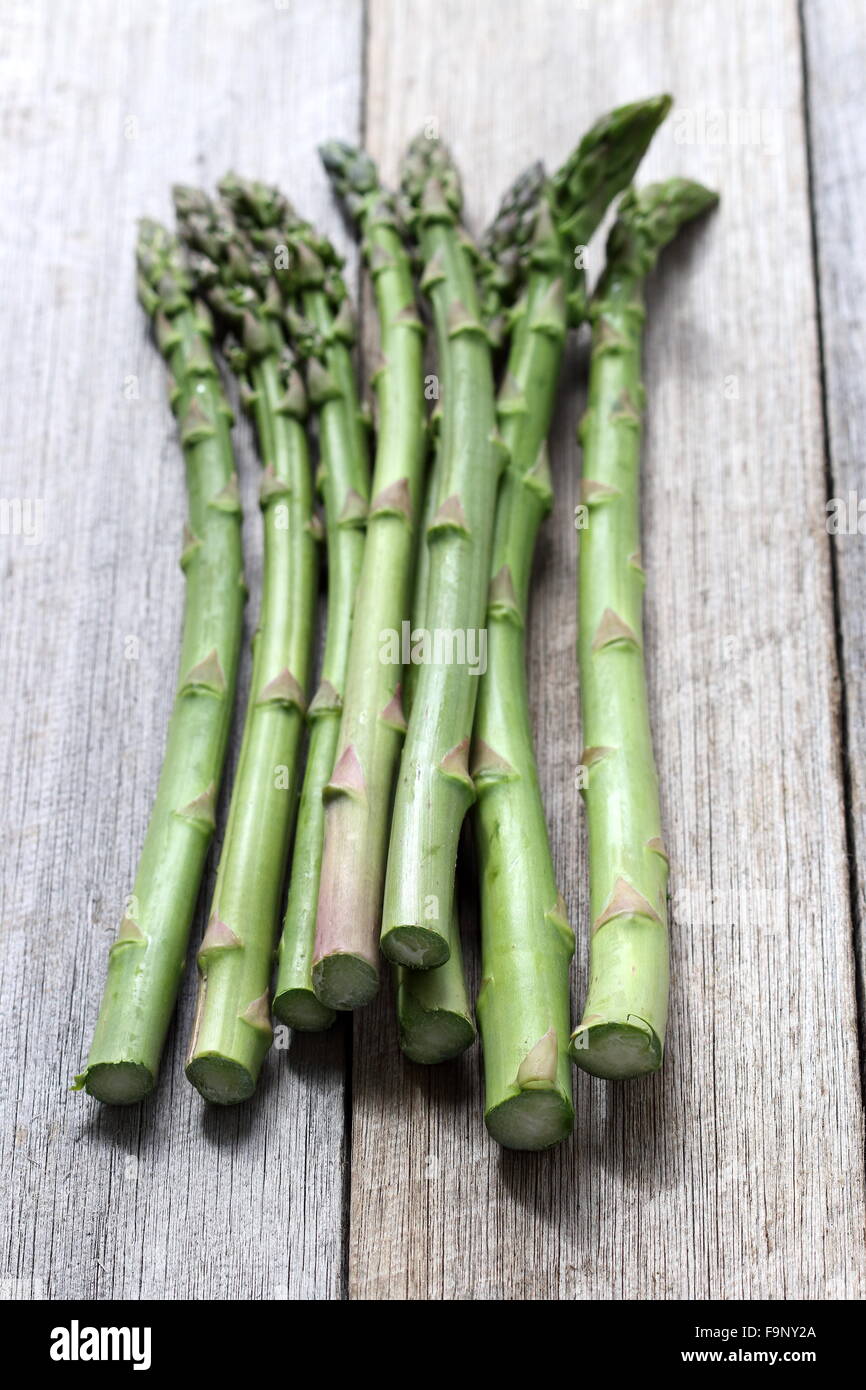 A bunch of asparagus  on a wooden board Stock Photo