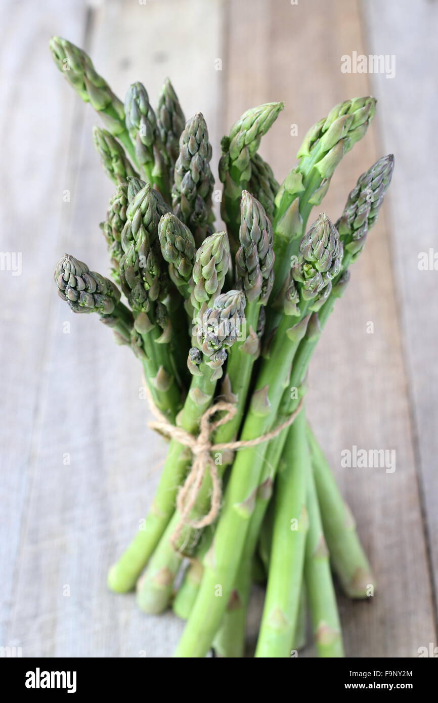 A bunch of asparagus  on a wooden board Stock Photo