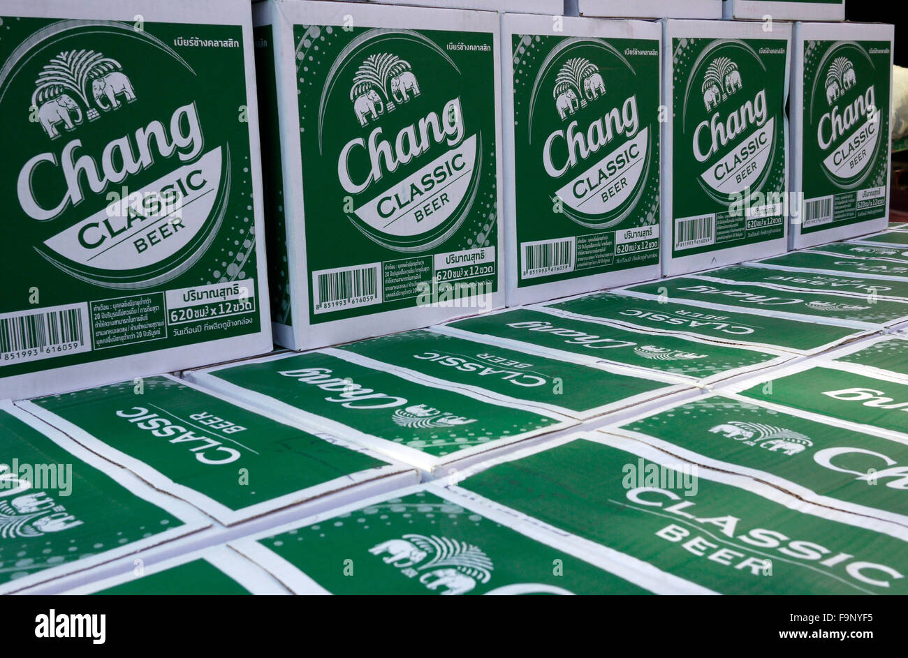 cardboard boxes of Chang Beer on the back of a pickup truck being delivered to a bar in Pattaya Thailand Stock Photo