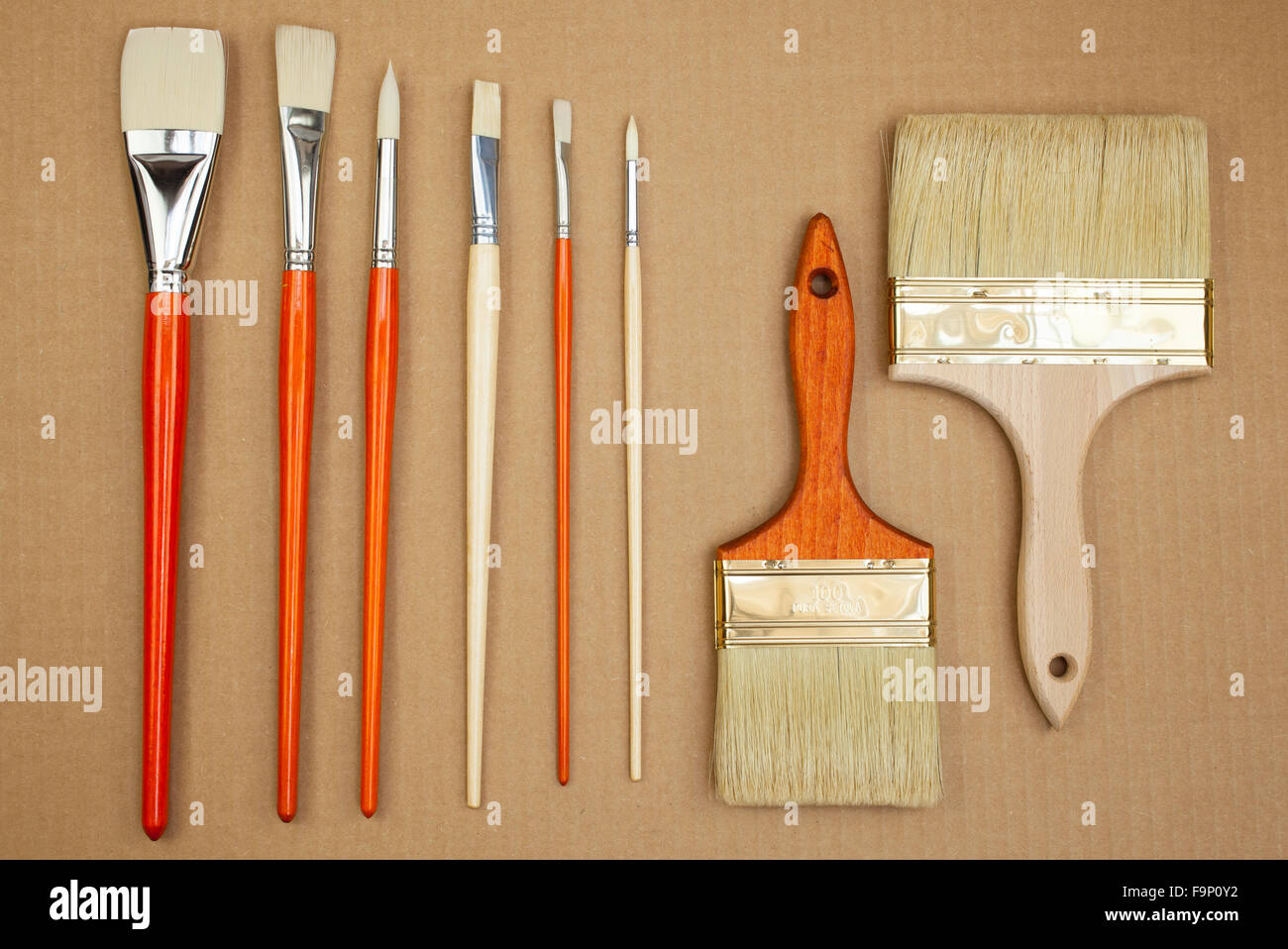 Various news paintbrushes on cardboard Stock Photo Alamy