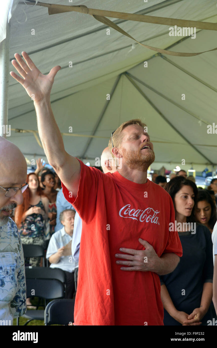 Man worships God during a tent revival in Riverdale Park, Md Stock Photo