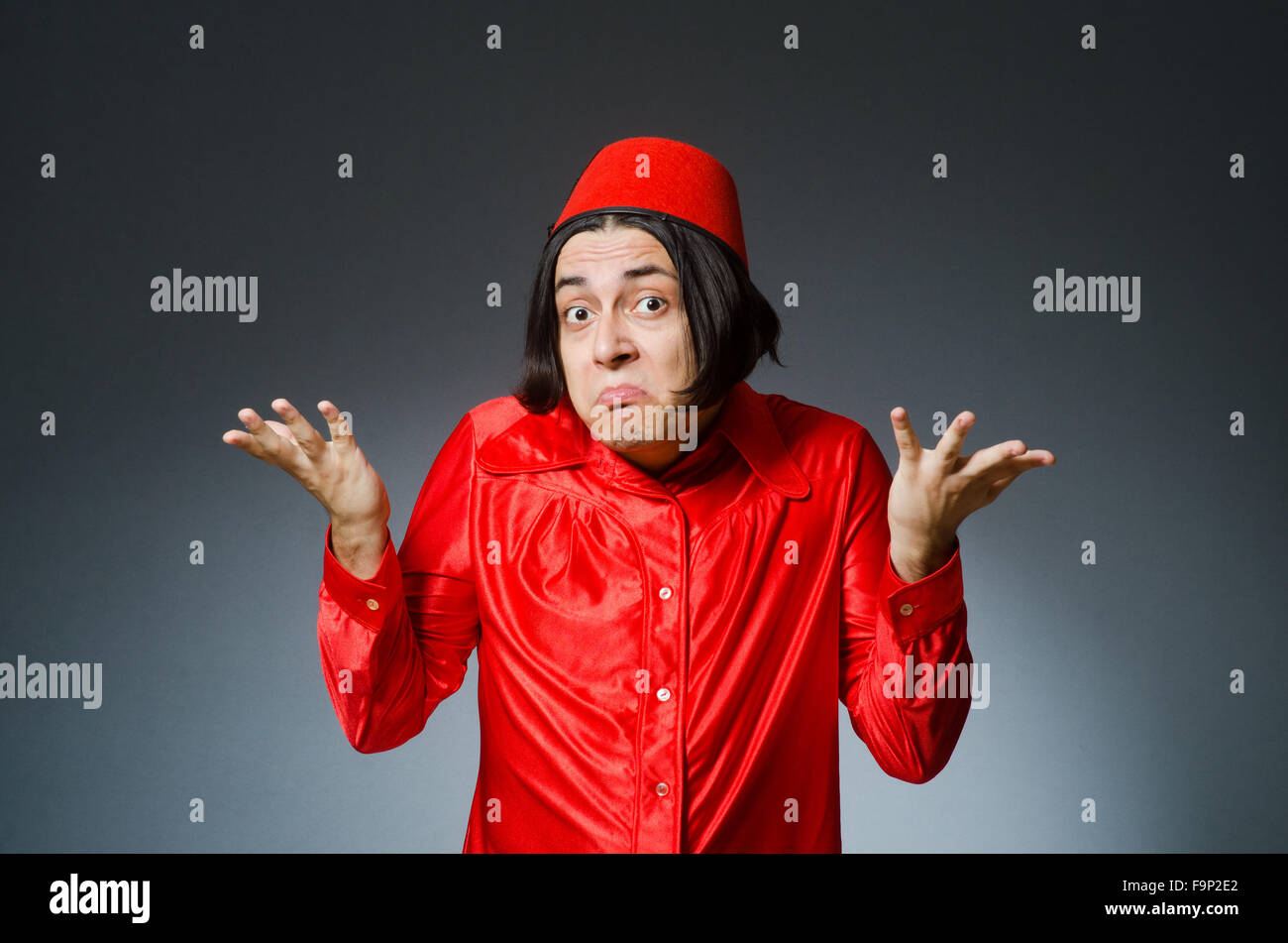Man wearing red fez hat Stock Photo Alamy