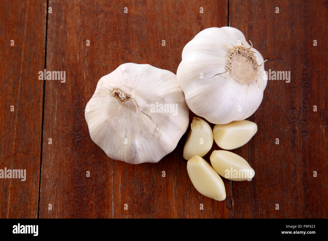 Organic garlic whole and cloves on the wooden background Stock Photo ...