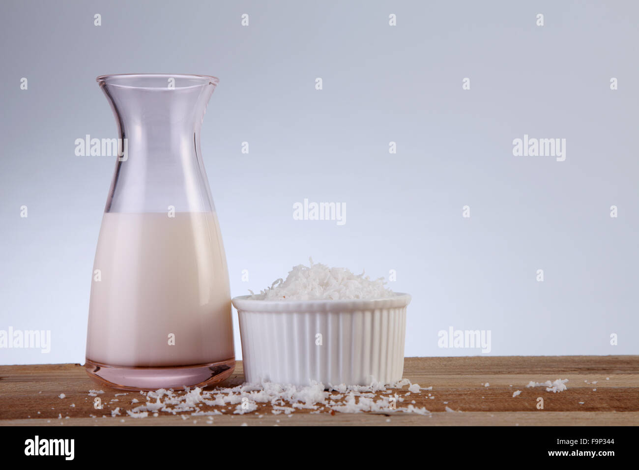 jar of coconut milk and shredded coconut Stock Photo