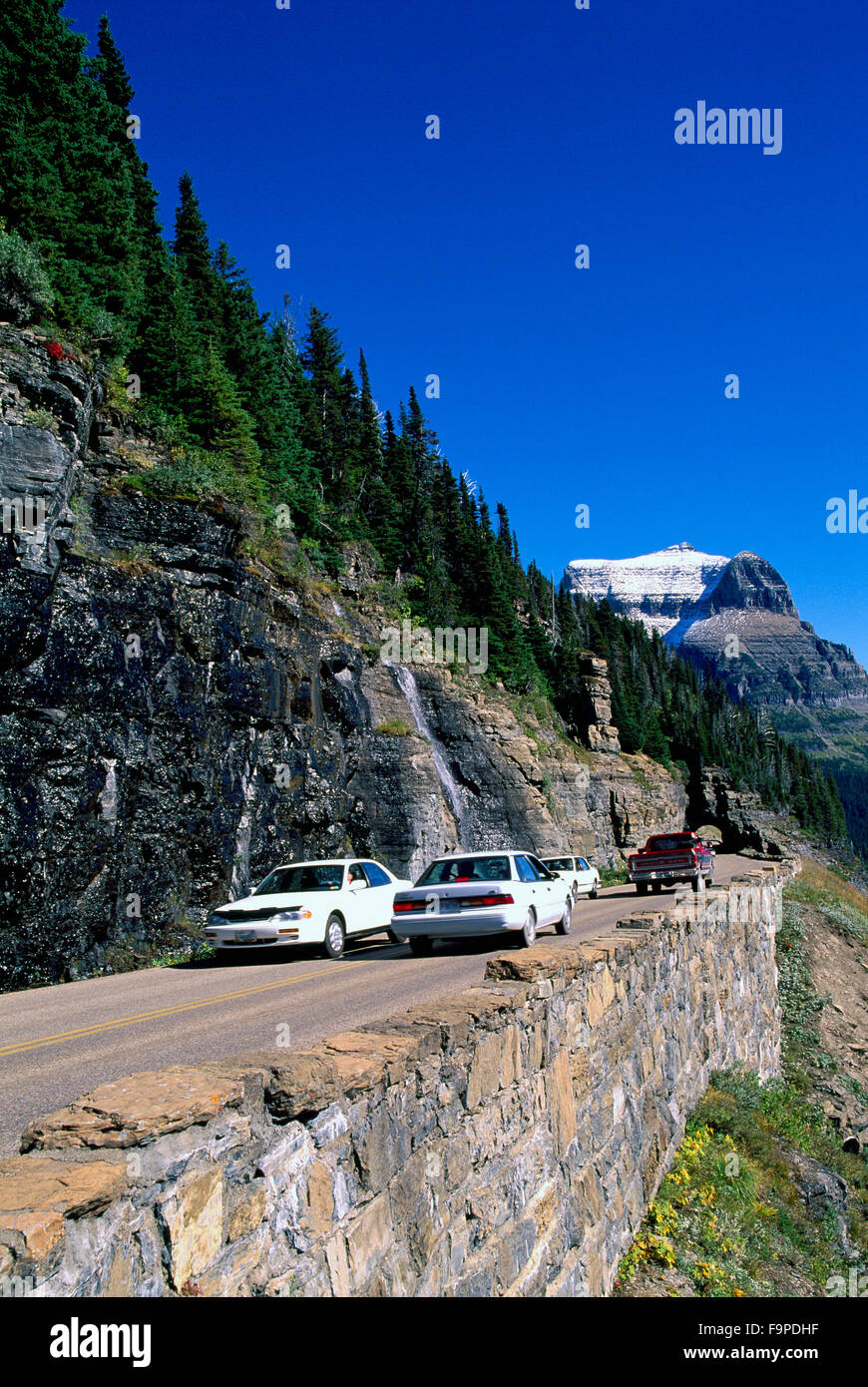 Glacier National Park, Montana, USA Cars passing slowly along a steep