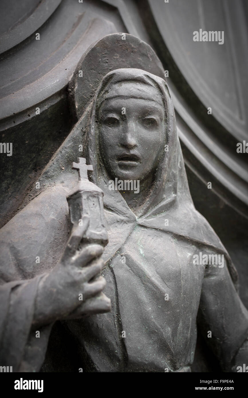 Stone statue of the Virgin Mary, with a surprised expression Stock