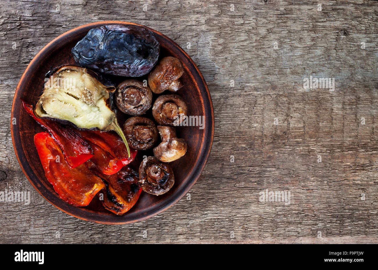 mix of grilled vegetables on clay plate view from above Stock Photo