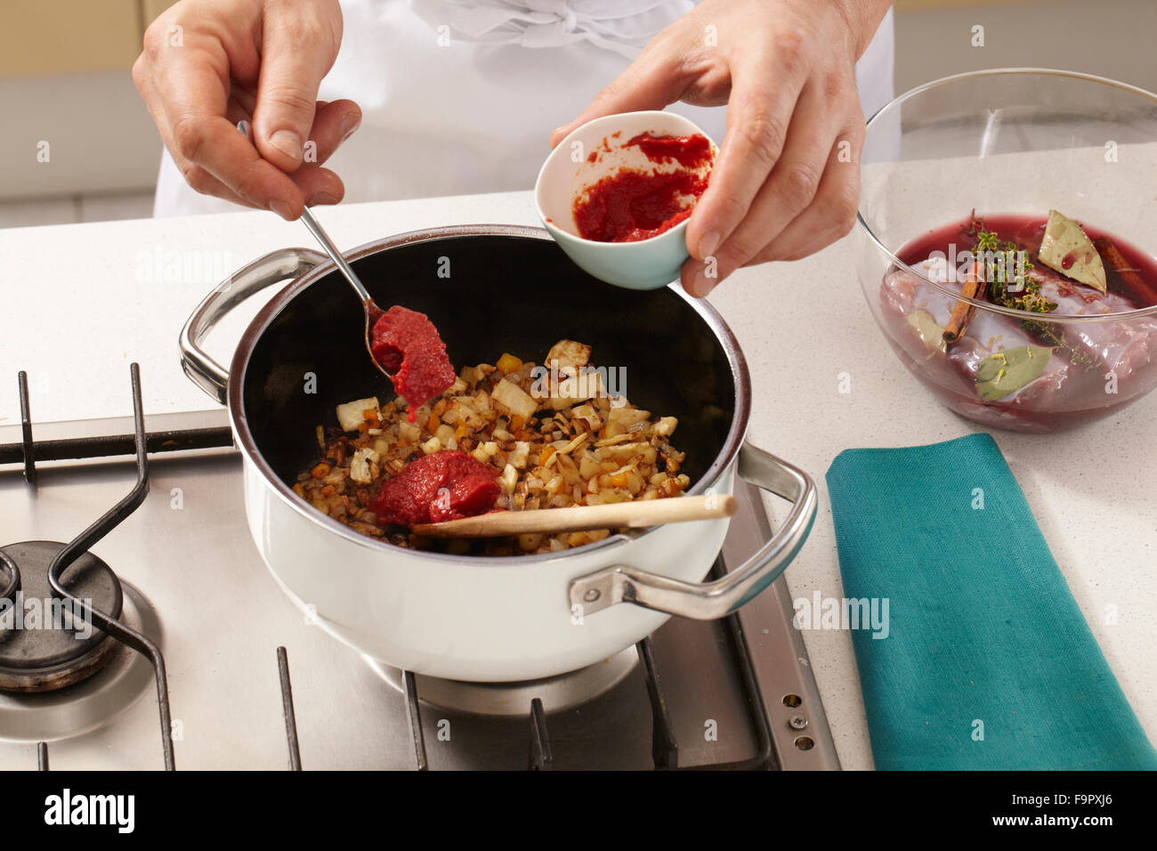 Rabbit in red wine sauce with batata croquettes + steps Stock Photo Alamy